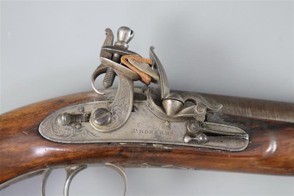 An early 19th century flintlock holster pistol, signed Prosser, length 15in.